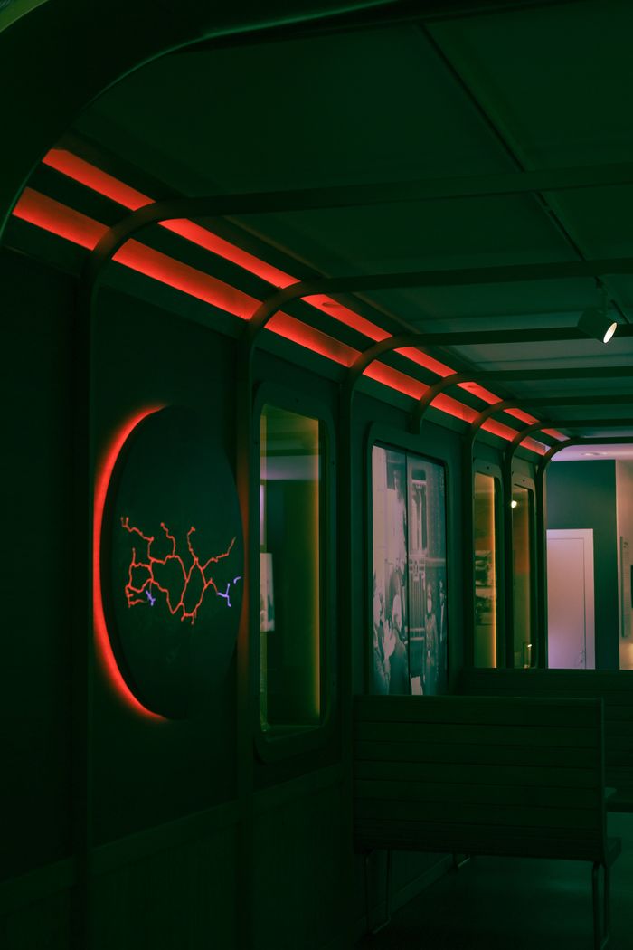 The Art of Drawing Readers In: Your attractive post title goes here Stylish modern interior with neon lighting and abstract circular art piece on wall.